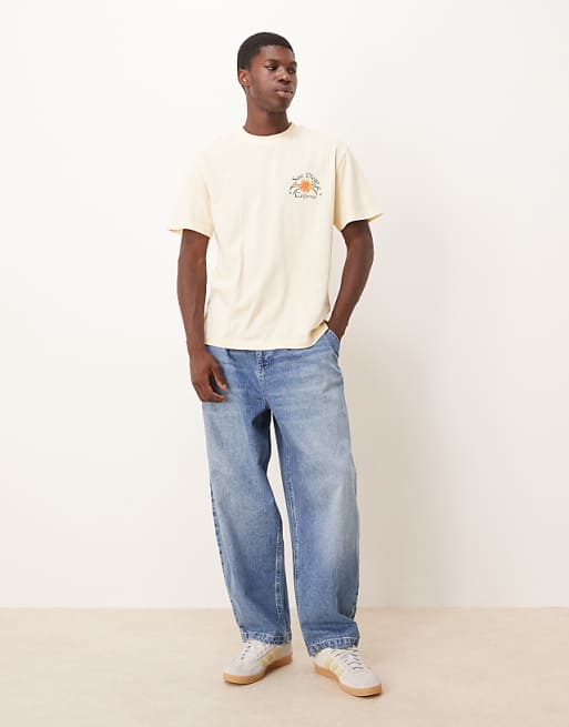 DESIGN oversized tapered jeans in light wash blue with pleats