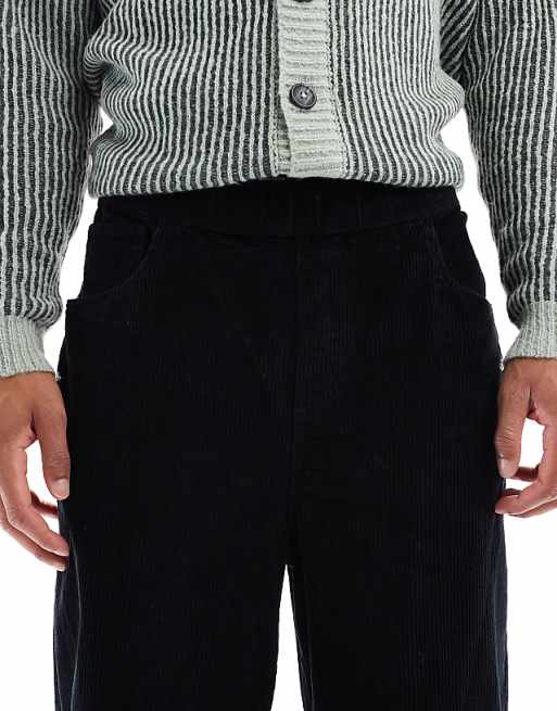 DESIGN Oversized Tapered Pull On Trousers In Black Corduroy