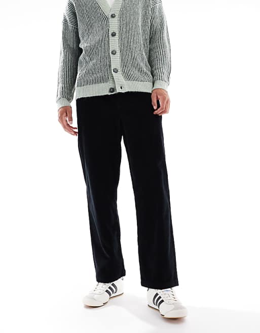 DESIGN oversized tapered pull on trousers in black corduroy