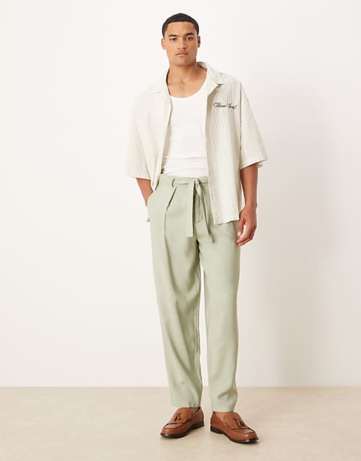 DESIGN oversized tapered smart trousers with belt detail in green