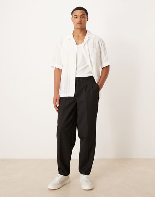 DESIGN oversized tapered trouser with double pleat in black