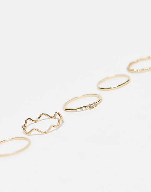 DESIGN Pack Of 12 Rings With Twist Details And Engraved Designs In Gold Tone