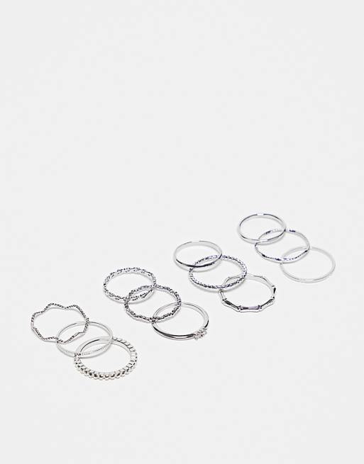 DESIGN pack of 12 rings with twist details and engraved designs in silver tone