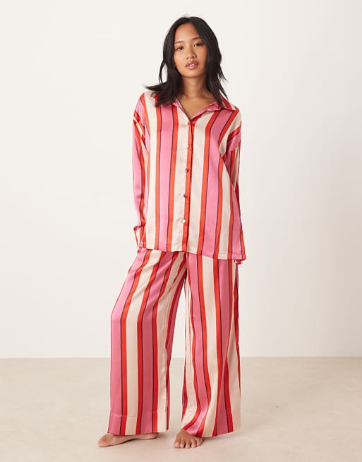 DESIGN Petite oversized satin stripe shirt and trouser pyjama set in red & pink stripe