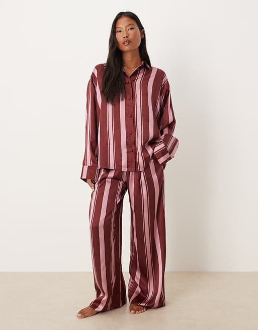 DESIGN Petite oversized satin stripe shirt and trouser pyjama set in burgundy stripe