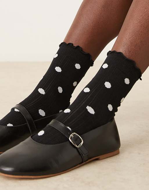 DESIGN polka dot socks with frill trim in black and white