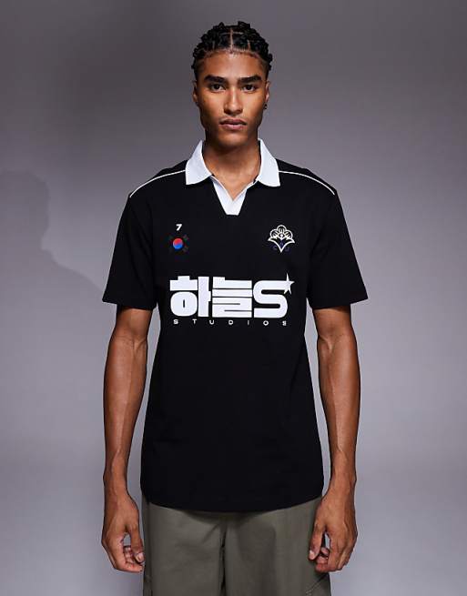 DESIGN relaxed polo with piping detail and sports graphic in black