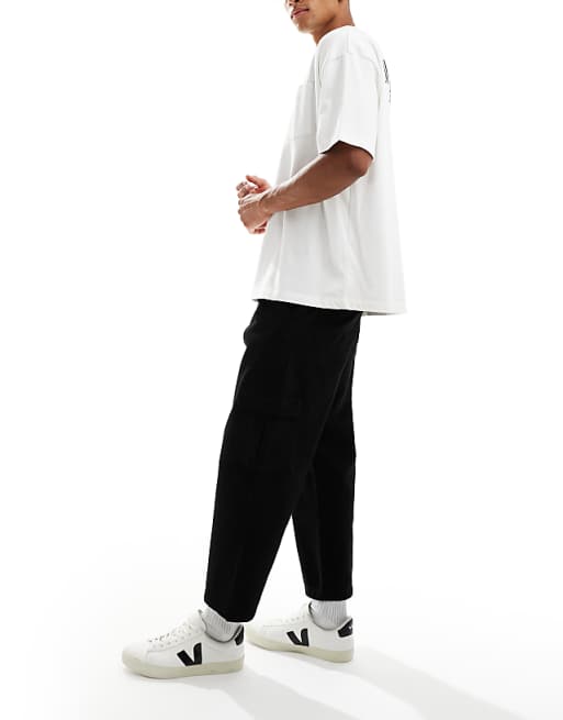 DESIGN relaxed tapered cargo trousers in black with pleats