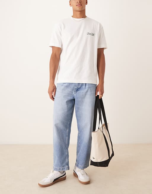 DESIGN relaxed tapered jeans in light wash blue