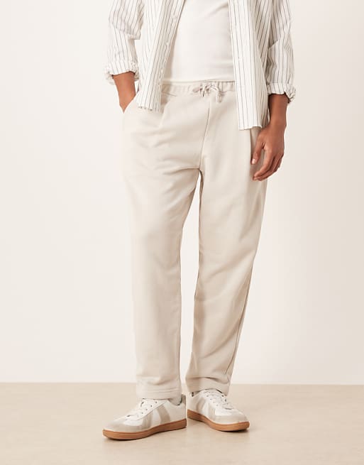 DESIGN Relaxed Tapered Joggers With Pleats In Stone