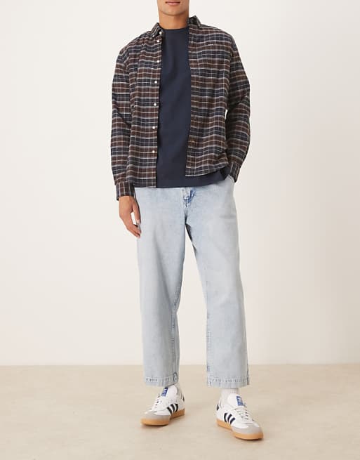 DESIGN relaxed tapered pleated jeans in bleach wash denim