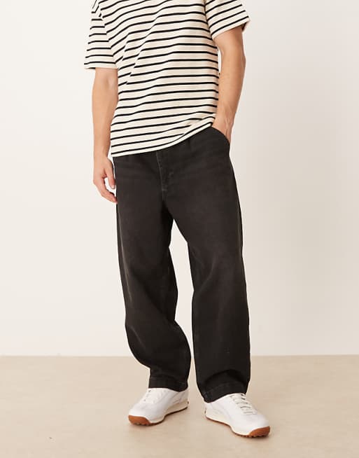 DESIGN relaxed tapered pleated jeans in washed black