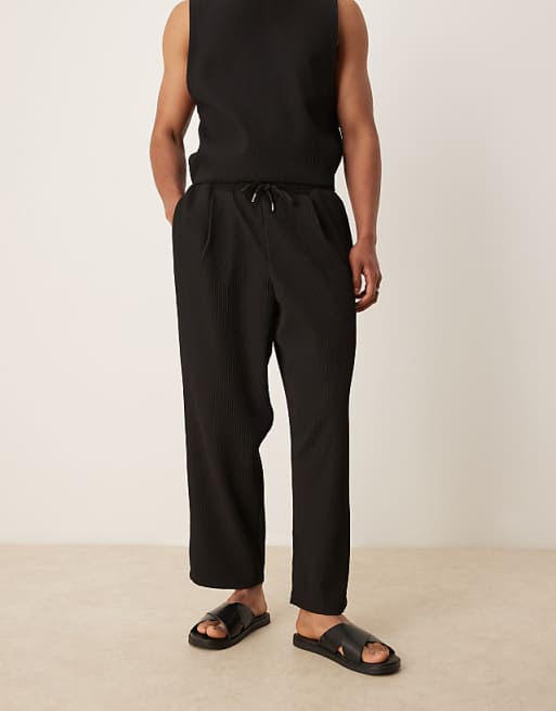 DESIGN relaxed tapered plisse joggers in black