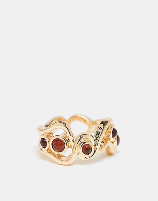 DESIGN ring with wavy design and faux-amber stone settings in gold tone