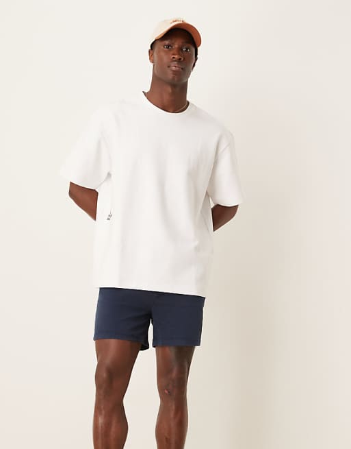 DESIGN shorter length skinny chino shorts in navy