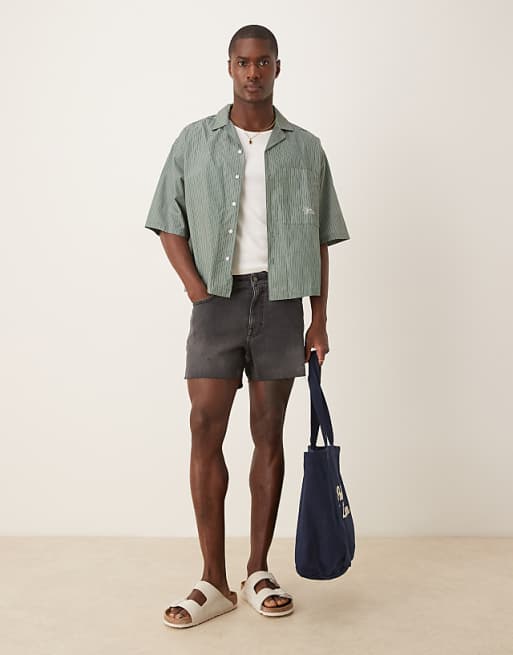 DESIGN Shorter Length Slim Denim Shorts With Rip Detail In Black