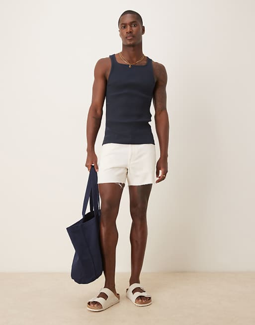 DESIGN shorter length slim denim shorts with rip detail in white