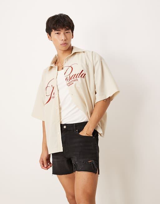 DESIGN Shorter Length Straight Fit Denim Shorts With Rip Detail In Black Wash