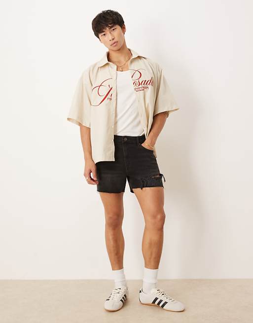 DESIGN shorter length straight fit denim shorts with rip detail in black wash
