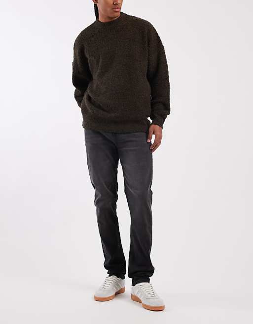DESIGN skinny jeans in black wash