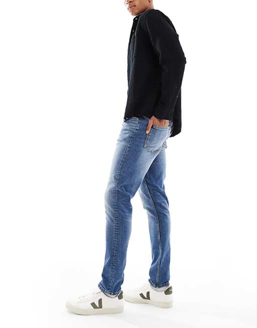 DESIGN Skinny Jeans In Mid Wash Blue