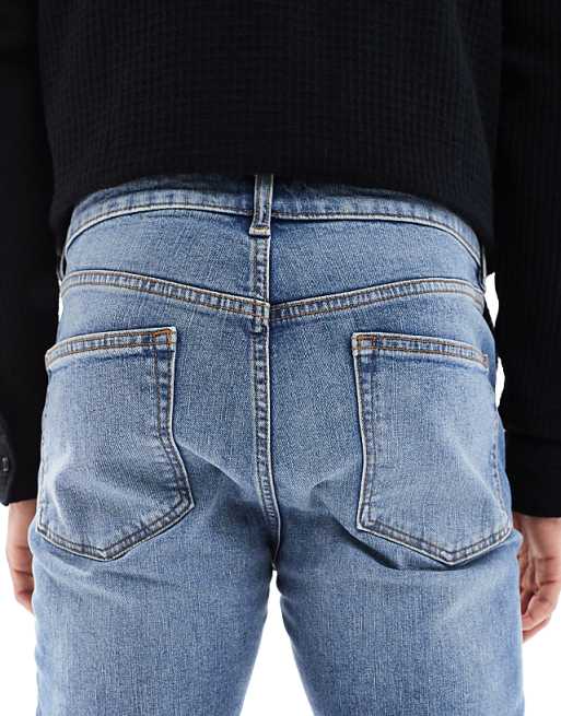 DESIGN Skinny Jeans In Mid Wash Blue