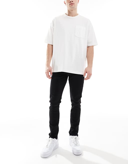 DESIGN skinny jeans in washed black