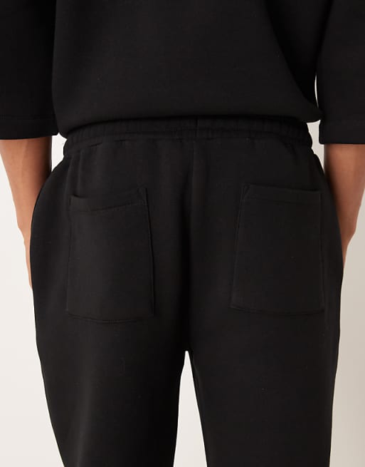 DESIGN Straight Leg Joggers With Pleat Details In Black