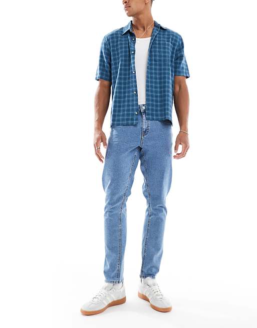 DESIGN stretch slim jeans in flat mid wash blue
