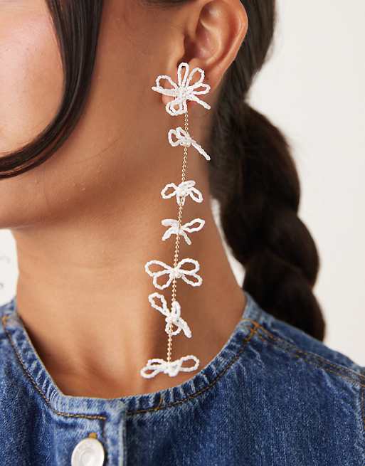 DESIGN stud earrings with long beaded floral pendant drops in white