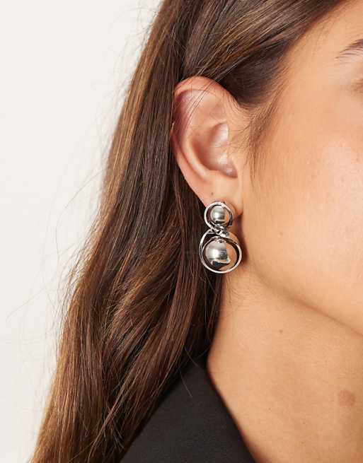 DESIGN stud earrings with spherical pendant drop in silver tone