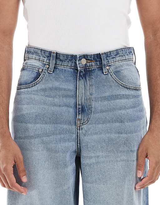 DESIGN Super Baggy Fit Jeans In Mid Wash Blue With Tint