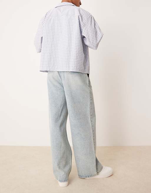 DESIGN Super Baggy Jeans With Front Pleats In Light Wash Blue