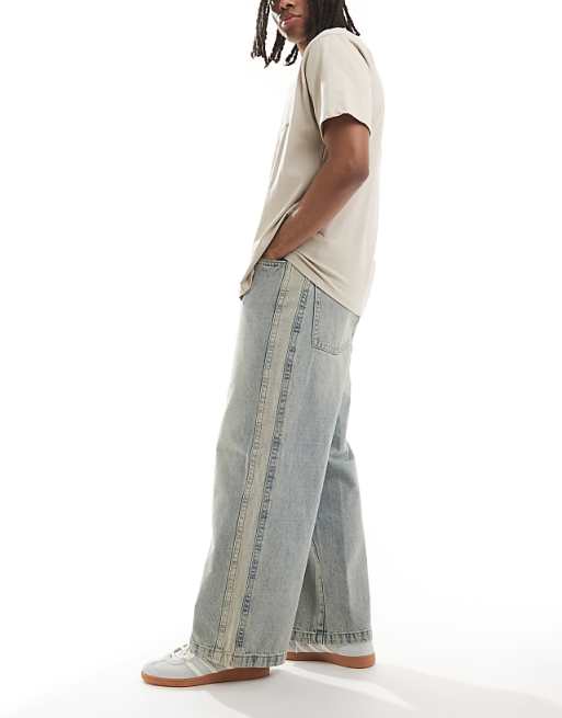 DESIGN Super Baggy Jeans With Side Panel In Yellow Tint Light Wash Blue