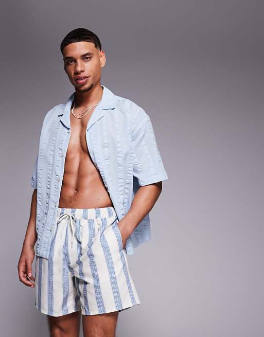 DESIGN swim shorts in mid length in blue stripe