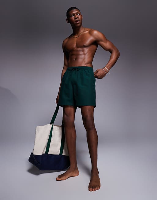 DESIGN swim shorts in mid length in dark green