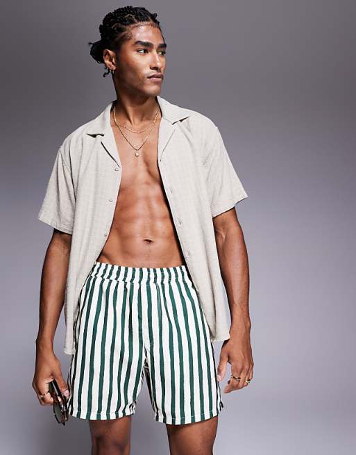 DESIGN swim shorts in mid length in green stripe