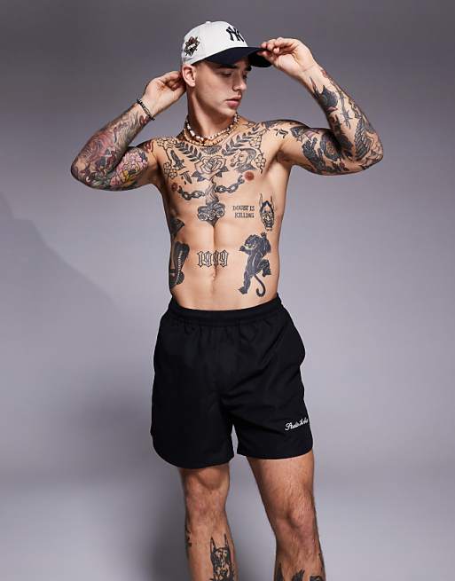 DESIGN swim shorts in mid length with embroidery placement in black