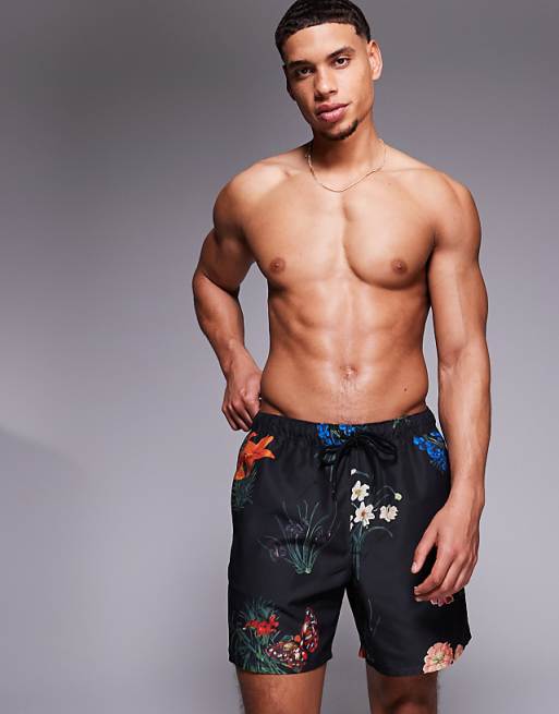 DESIGN swim shorts in mid length with floral print in black