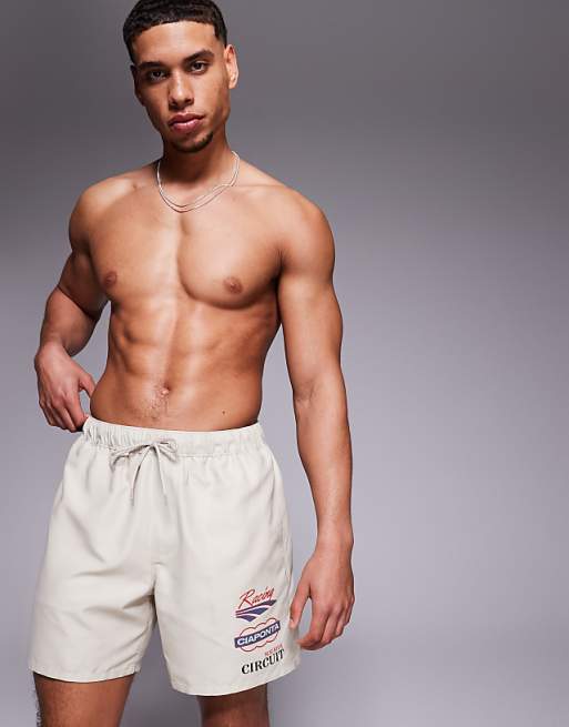 DESIGN swim shorts in mid length with placement print in beige