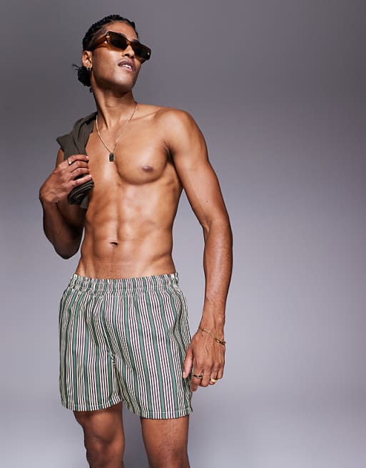 DESIGN swim shorts in short length in green stripe