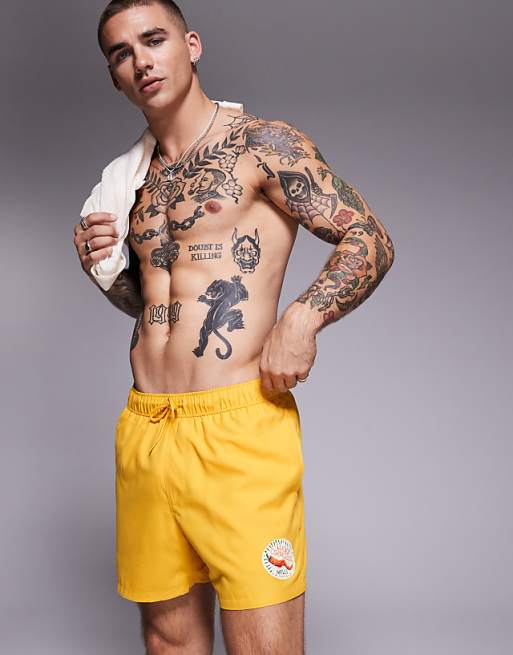 DESIGN swim shorts in short length in yellow