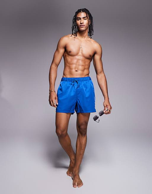 DESIGN swim shorts in short length with embroidery in blue