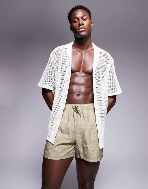 DESIGN swim shorts in short length with floral print in green