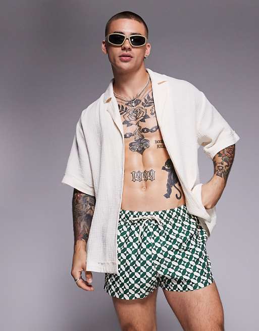 DESIGN swim shorts in super short length in geo print in green