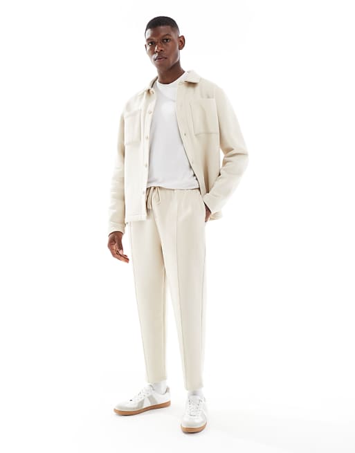 DESIGN Tapered Fit Fixed Hem Joggers With Pleats In Stone