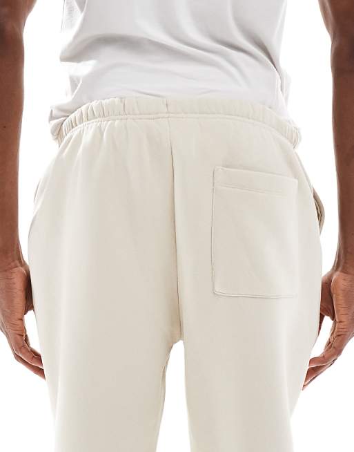 DESIGN Tapered Fit Fixed Hem Joggers With Pleats In Stone