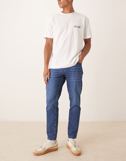 DESIGN tapered fit jeans in dark wash blue