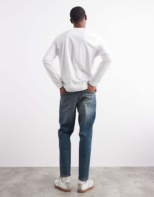 DESIGN Tapered Fit Jeans With Tint In Mid Wash Blue