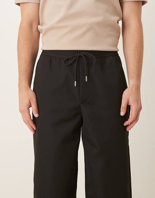 DESIGN Tapered Fit Smart Trousers With Elasticated Waistband In Black
